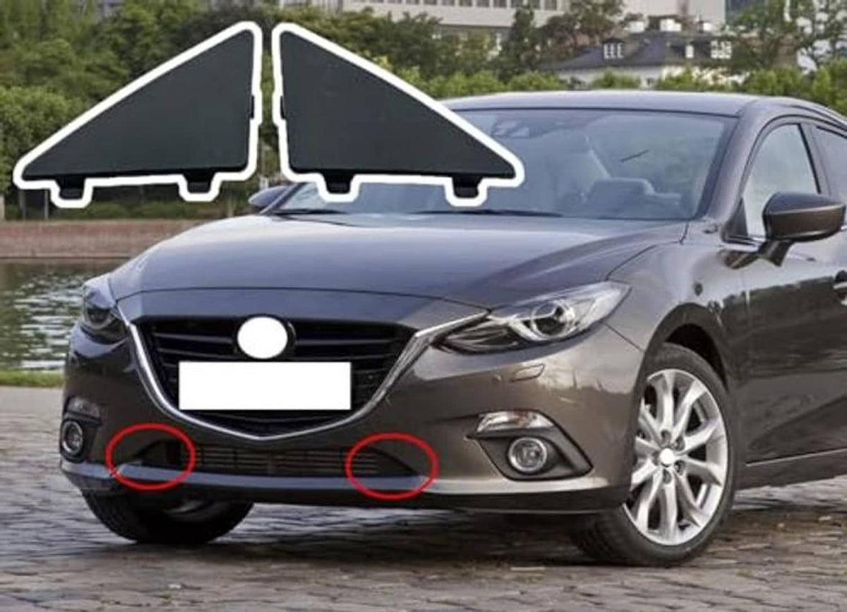 Pair of dark triangular front bumper grille filler inserts outlined for front placement