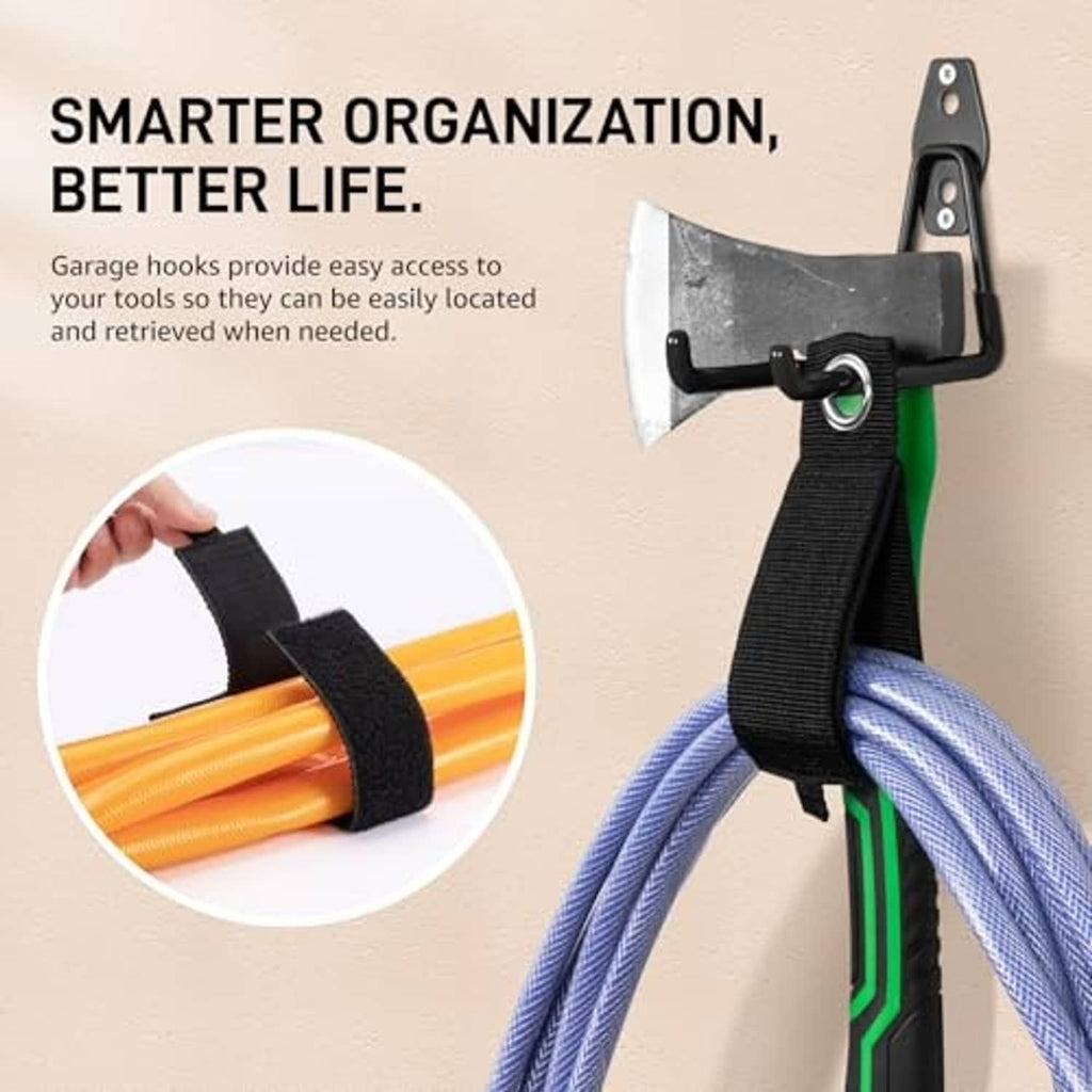 Black garage wall hook holding bundled straps for organized storage