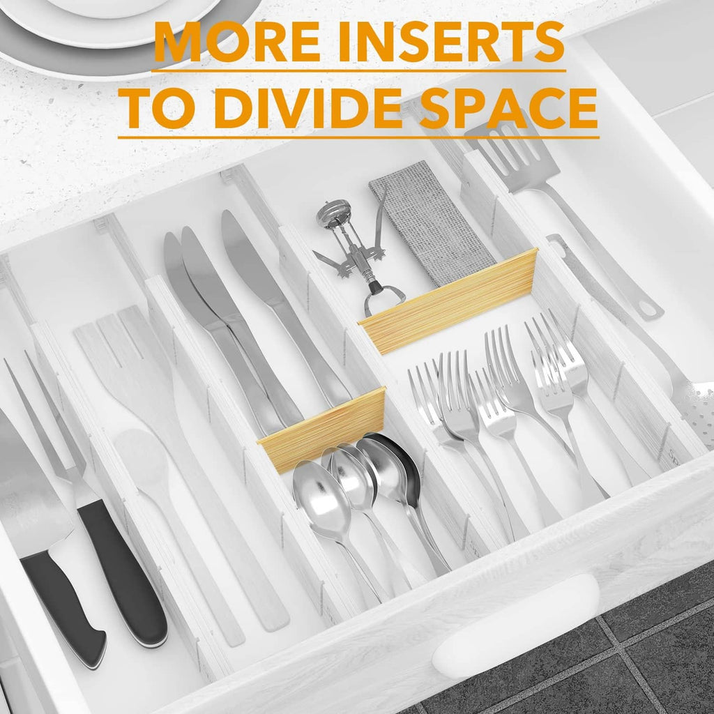 Bamboo drawer divider inserts arranged in a white cutlery drawer for space division