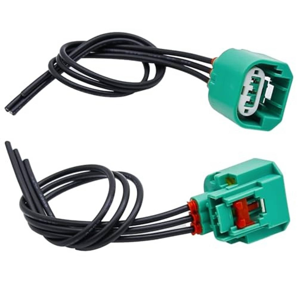 Headlight wiring harness with green connectors, black cable leads, and red locking insert