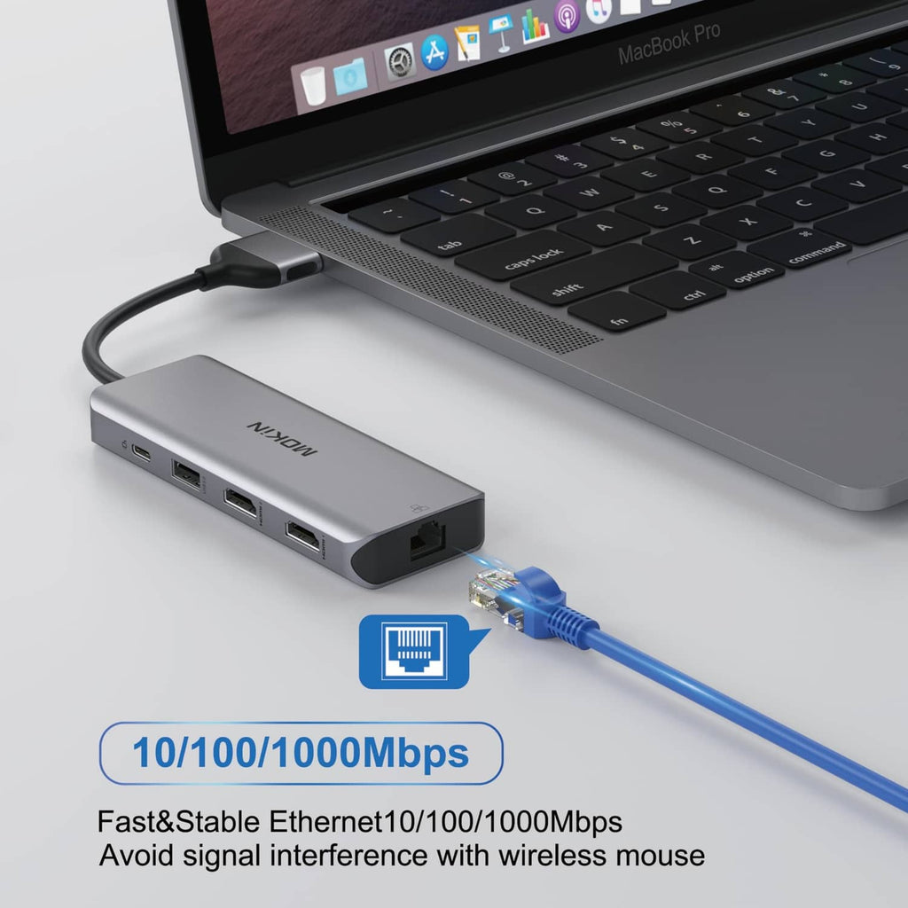 Grey USB-C docking station with Ethernet adapter and connected blue network cable