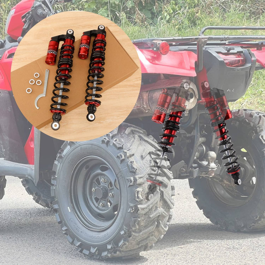 Red and black rear shock absorbers installed on ATV, with included mounting parts