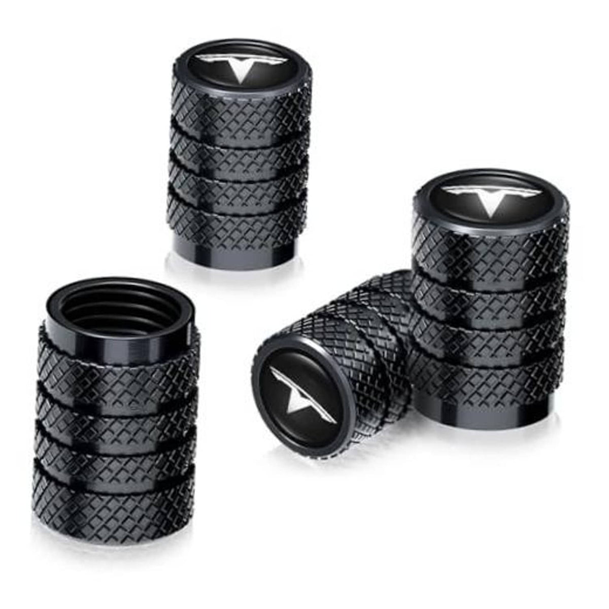 Set of black tire valve stem caps with textured grip and V-style emblem on top
