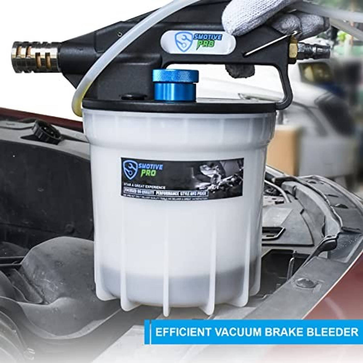 Pneumatic vacuum brake bleeder mounted in engine bay, white tank with blue control button