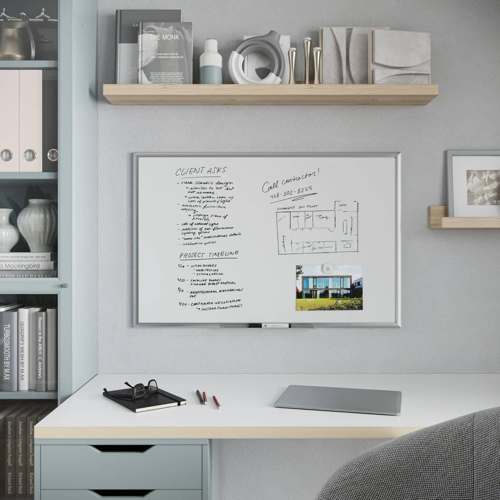 White magnetic dry erase board with silver aluminum frame and marker tray, shown mounted