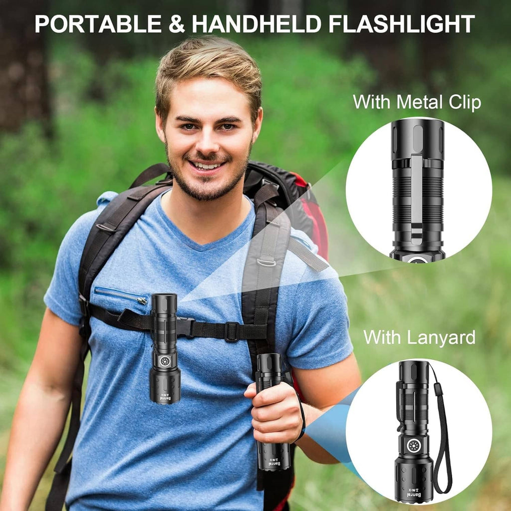 Black compact LED flashlight with metal clip and lanyard, handheld view