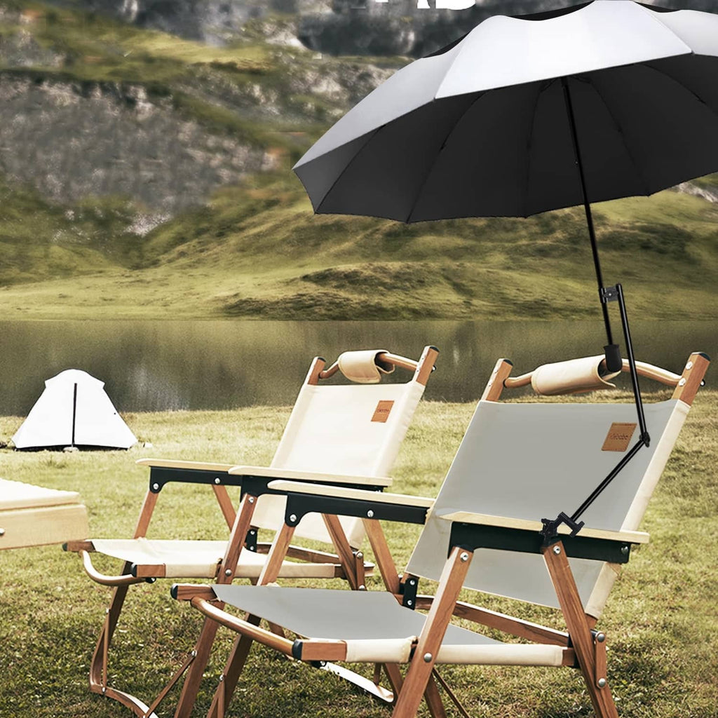 Golf umbrella above a patio lounge chair set with white and dark striped canopy.