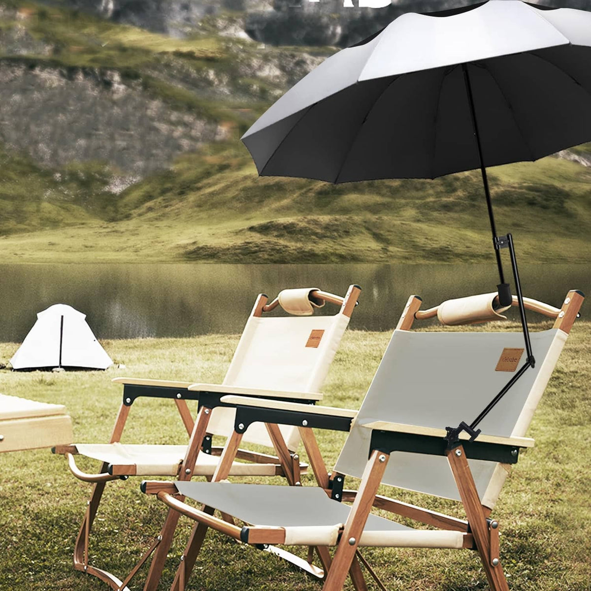 Golf umbrella above a patio lounge chair set with white and dark striped canopy.