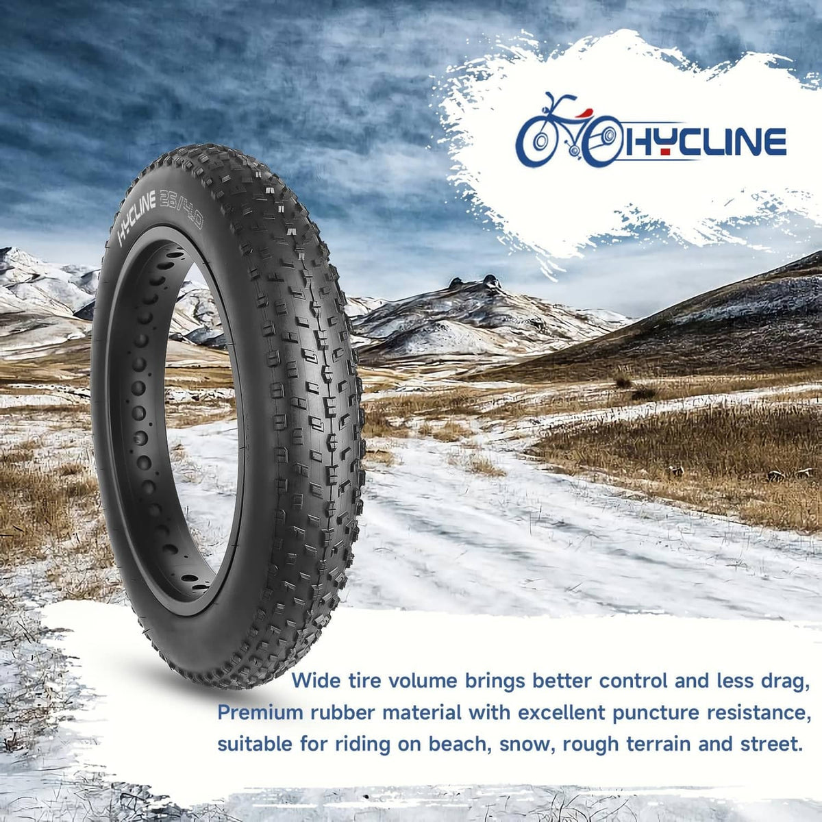 Black fat bike tire on snowy terrain with deep tread lugs and side knobs