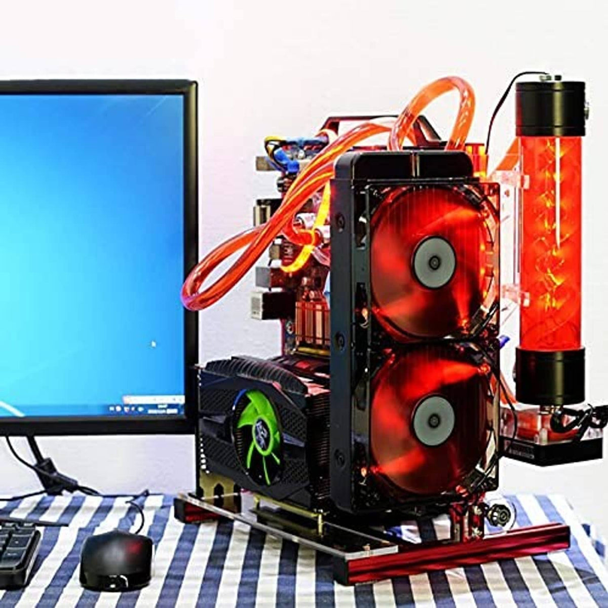 DIY computer build on red motherboard rack with dual red-lit fans and cable wiring