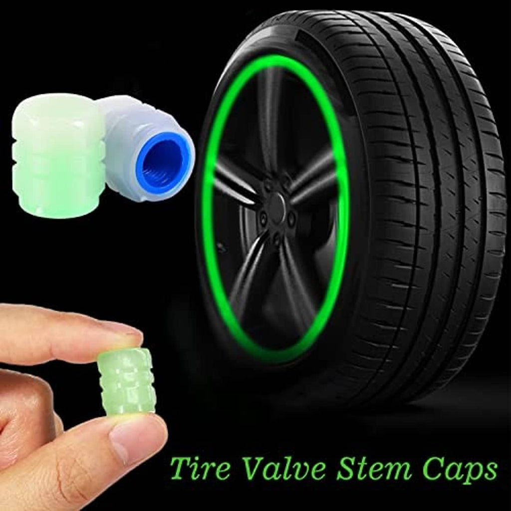 Glow-in-the-dark tire valve stem caps in green and blue with one cap held by hand