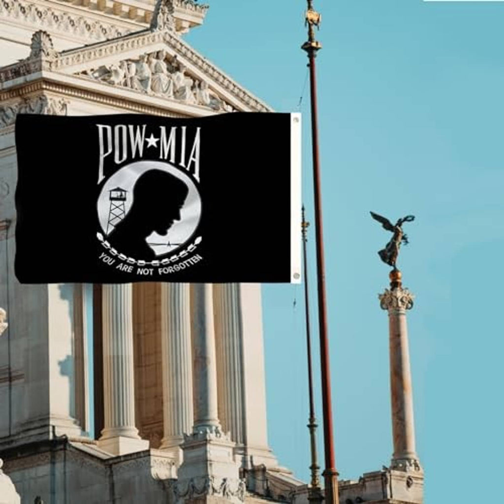POW-MIA flag banner on building, black with circular profile and 'You are not forgotten'