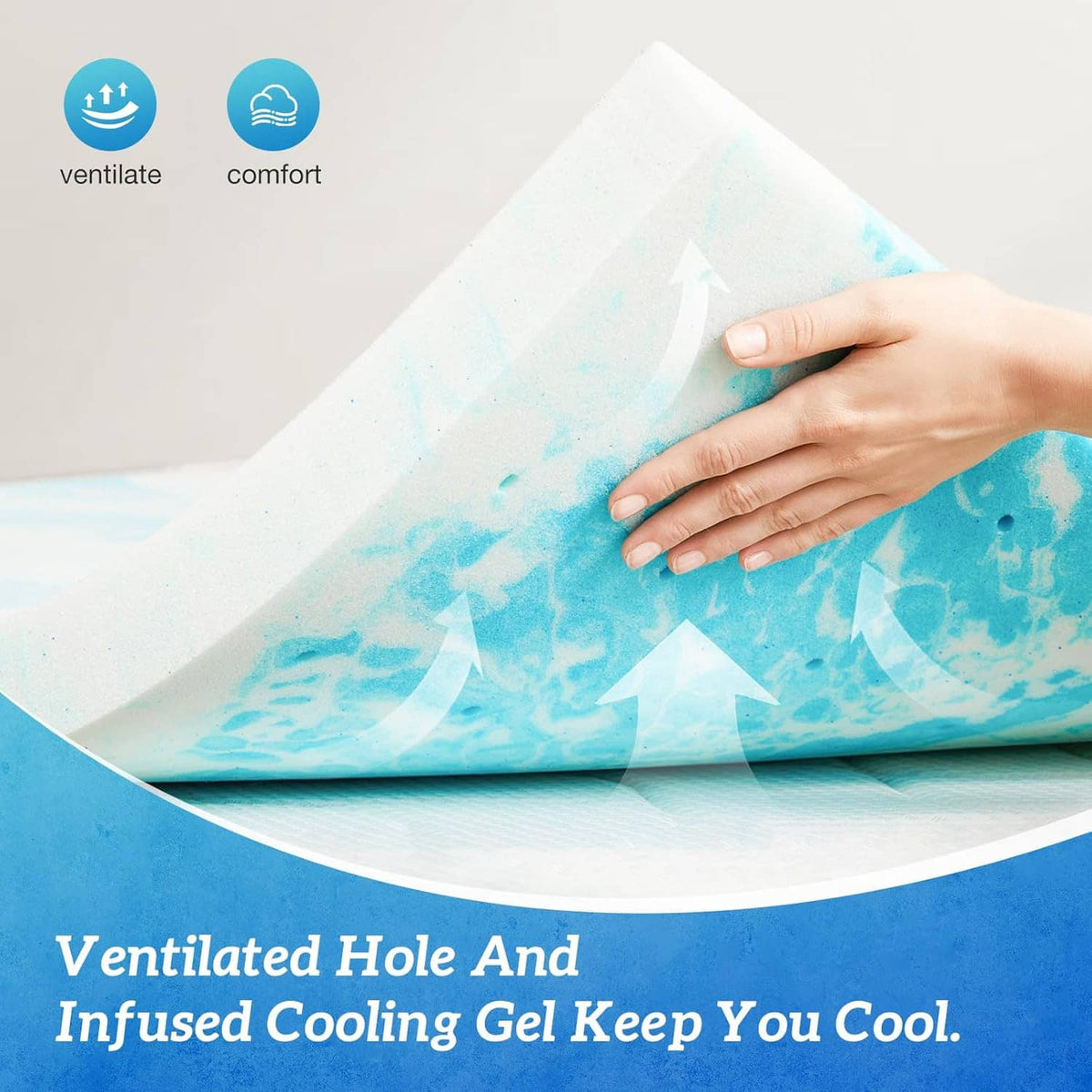 Blue cooling gel mattress topper with hands folding the fabric layer