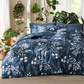 Navy floral comforter set with matching pillow shams and decorative pillows on a queen bed