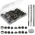 Leather snap fasteners kit with metal buttons, punch tools, and snap hardware pieces