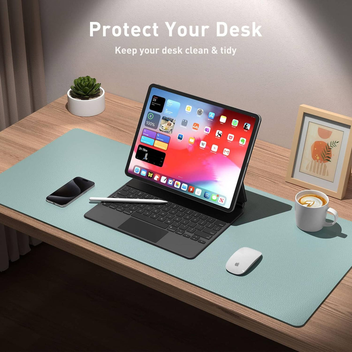 Light blue desk pad on office table under laptop and mouse