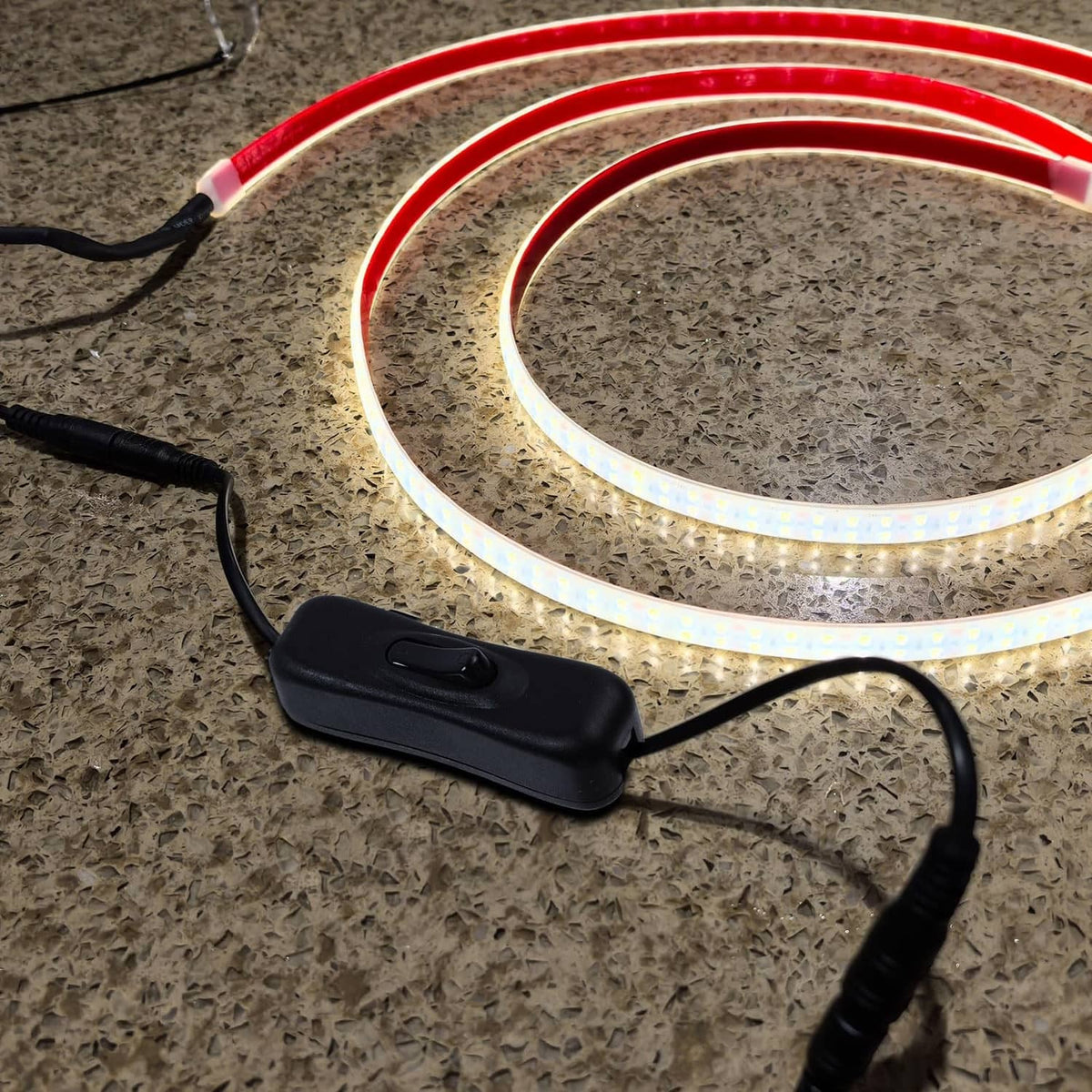 Black inline on/off switch for DC LED strip, connected between power and light