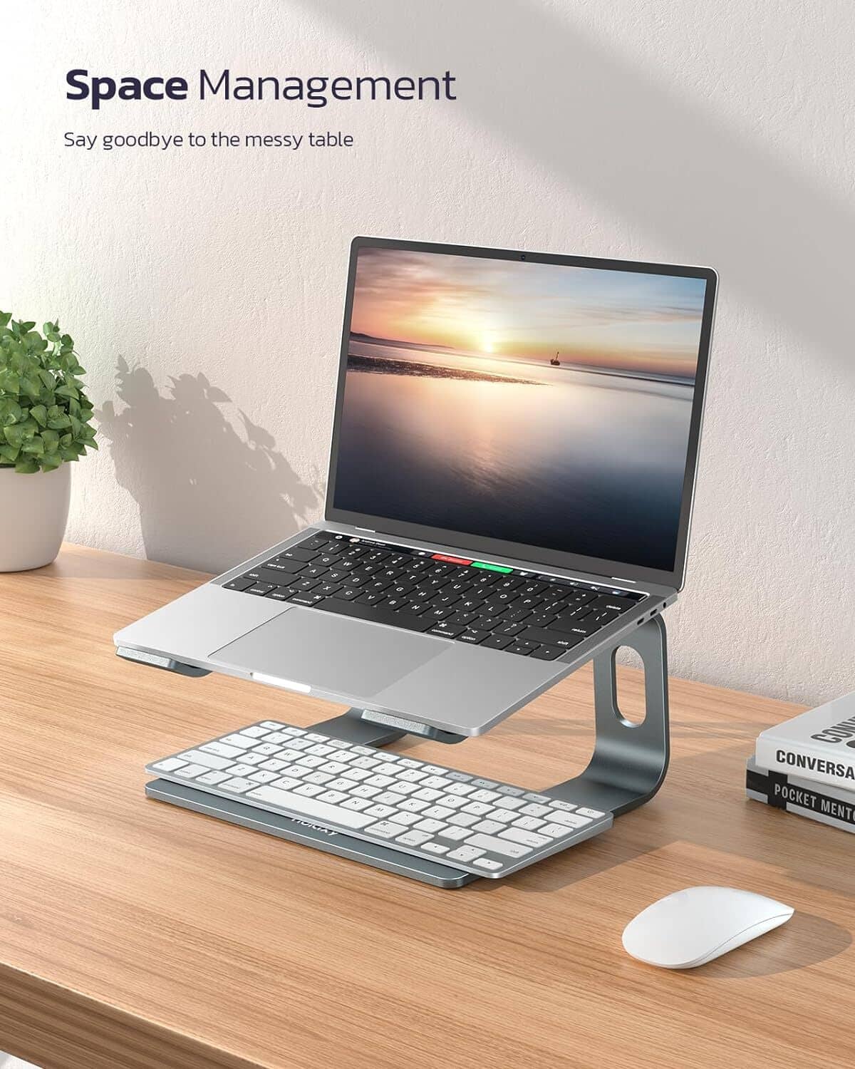 Dark gray laptop stand riser with wide platform to lift keyboard and reduce mess