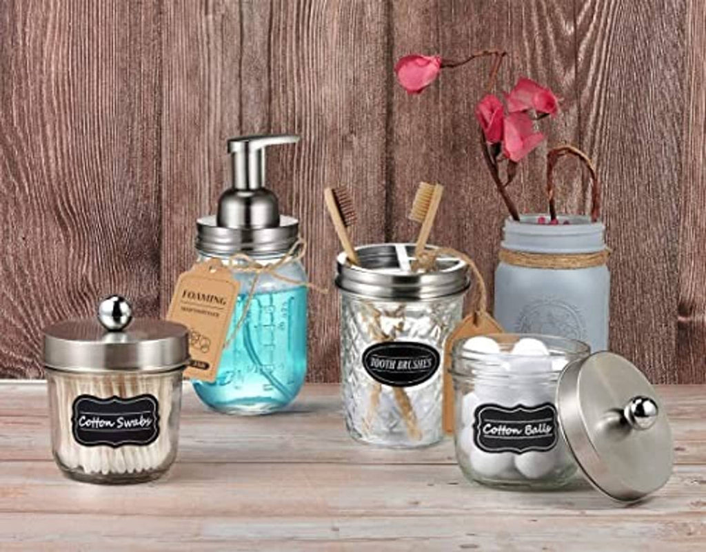 Stainless steel foaming dispenser pump lids on multiple mason jars, with lids and tubes