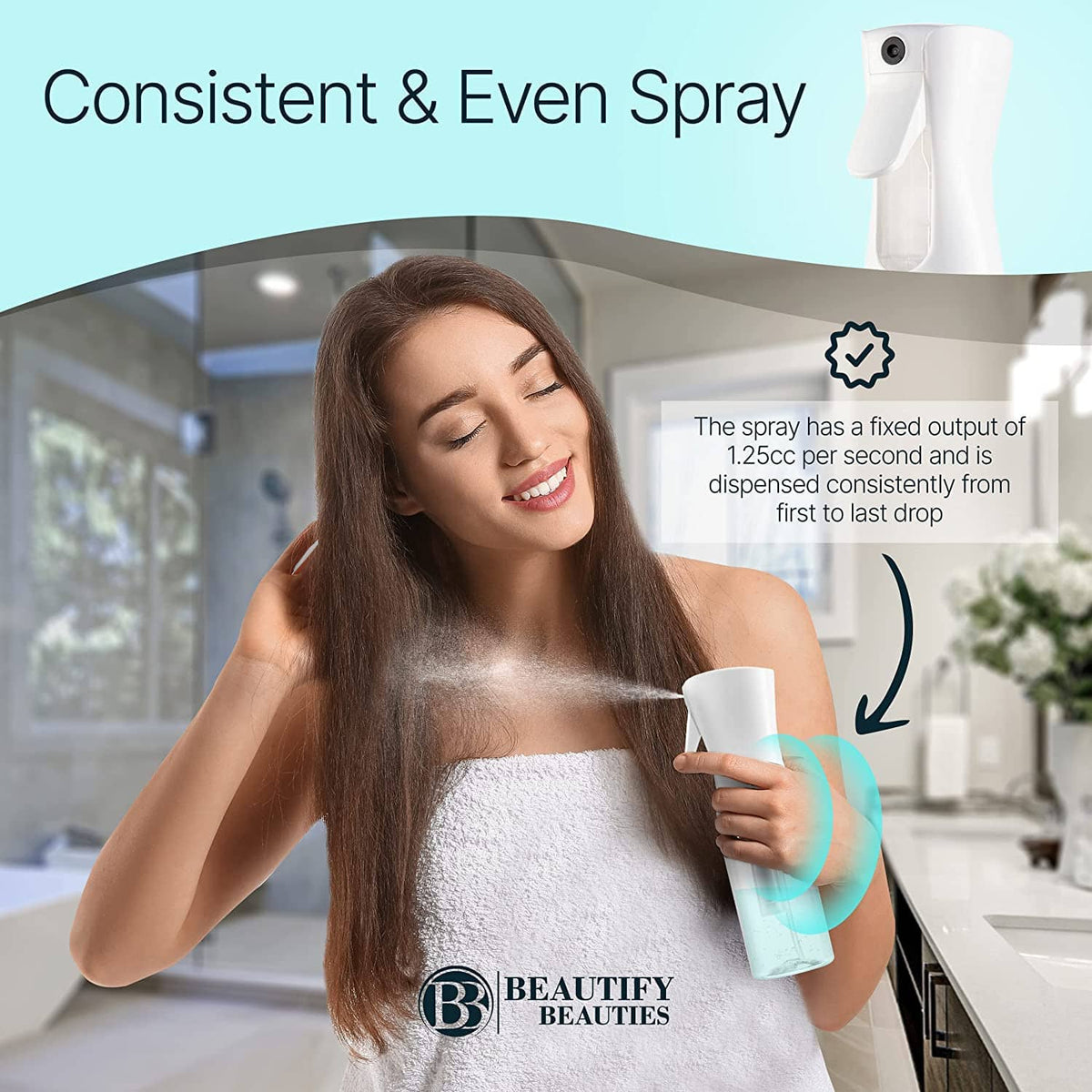 White continuous mist hair spray bottle held in hand during hair spritzing
