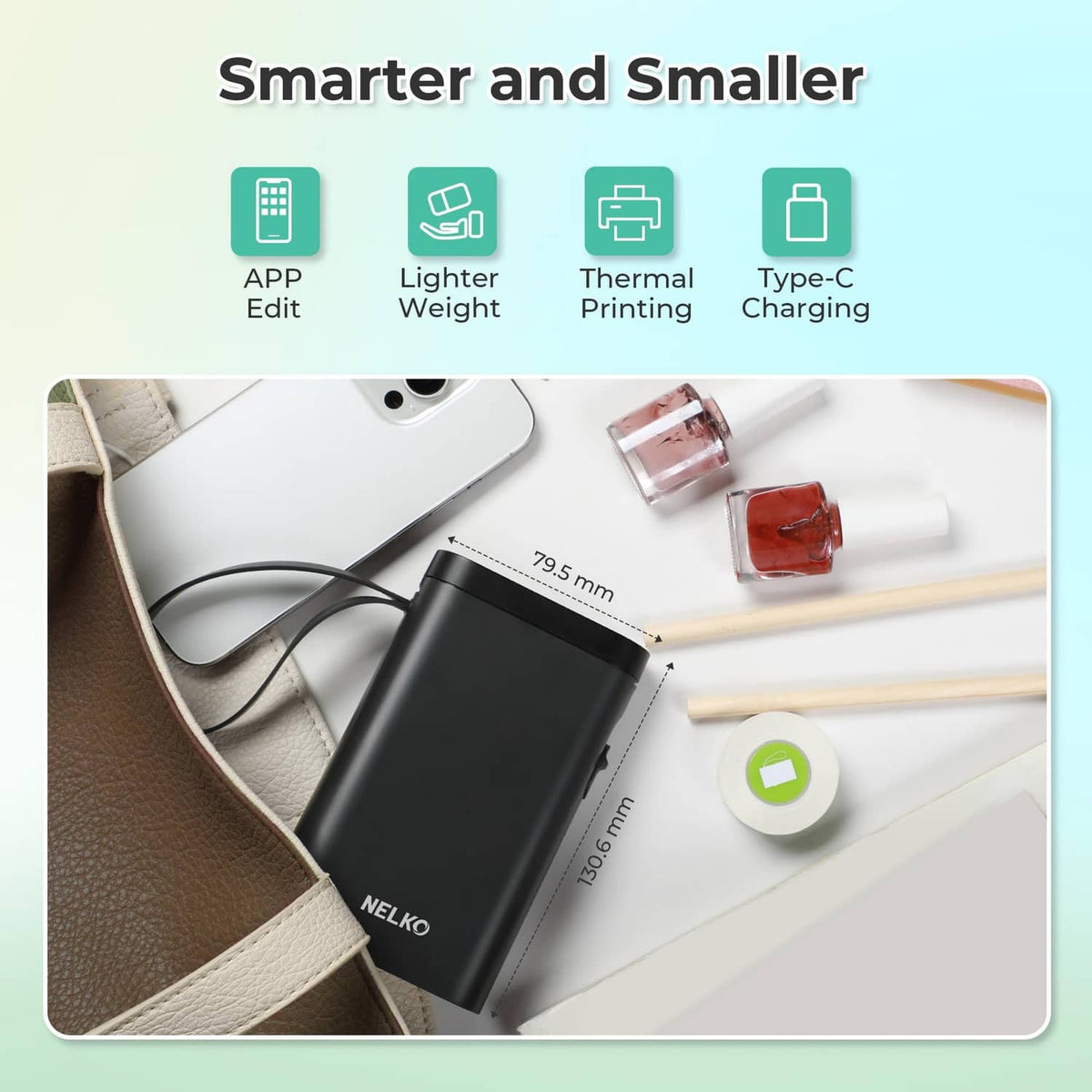 Compact black Bluetooth label printer shown with accessories on a work surface.