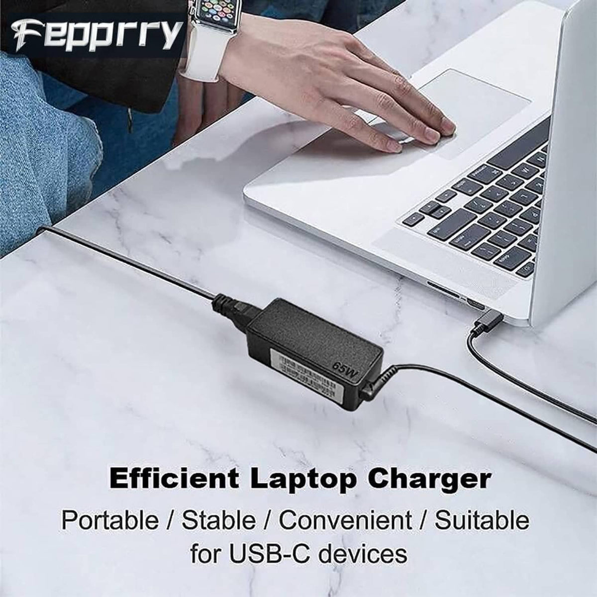 USB-C laptop charger with black adapter and USB-C cable connected to laptop