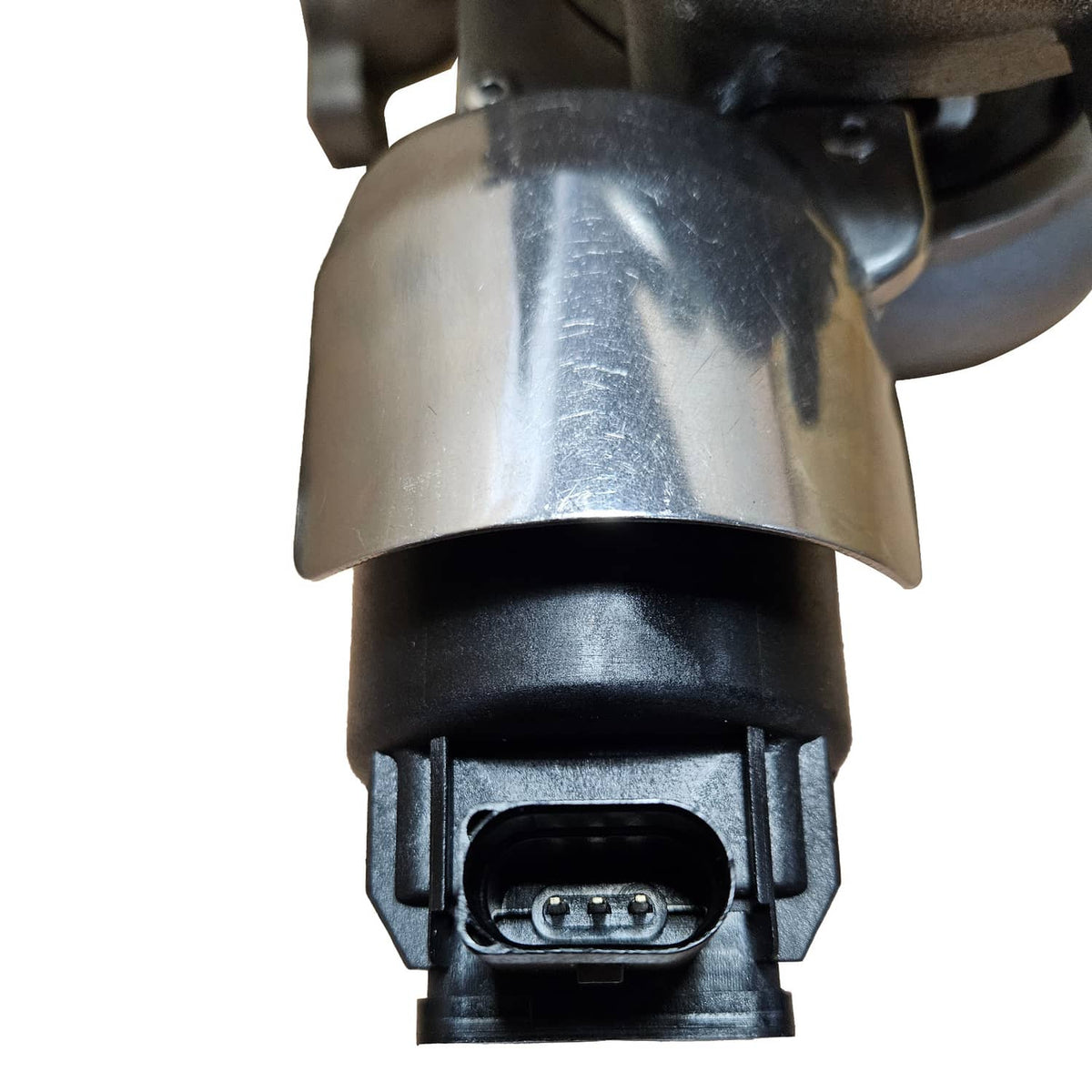 Turbocharger sensor connector on black mount, close-up detail
