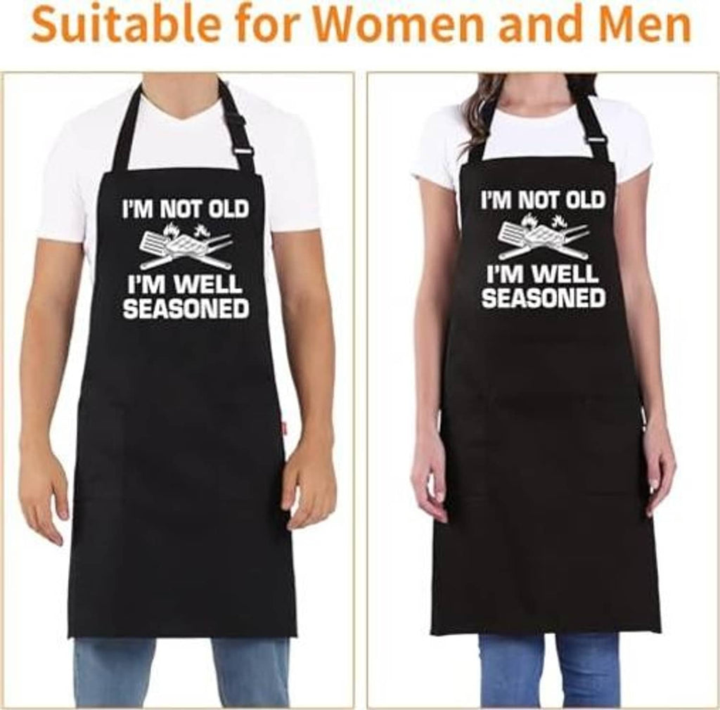 Black grilling apron with adjustable neck strap and “I’M WELL SEASONED” humorous text