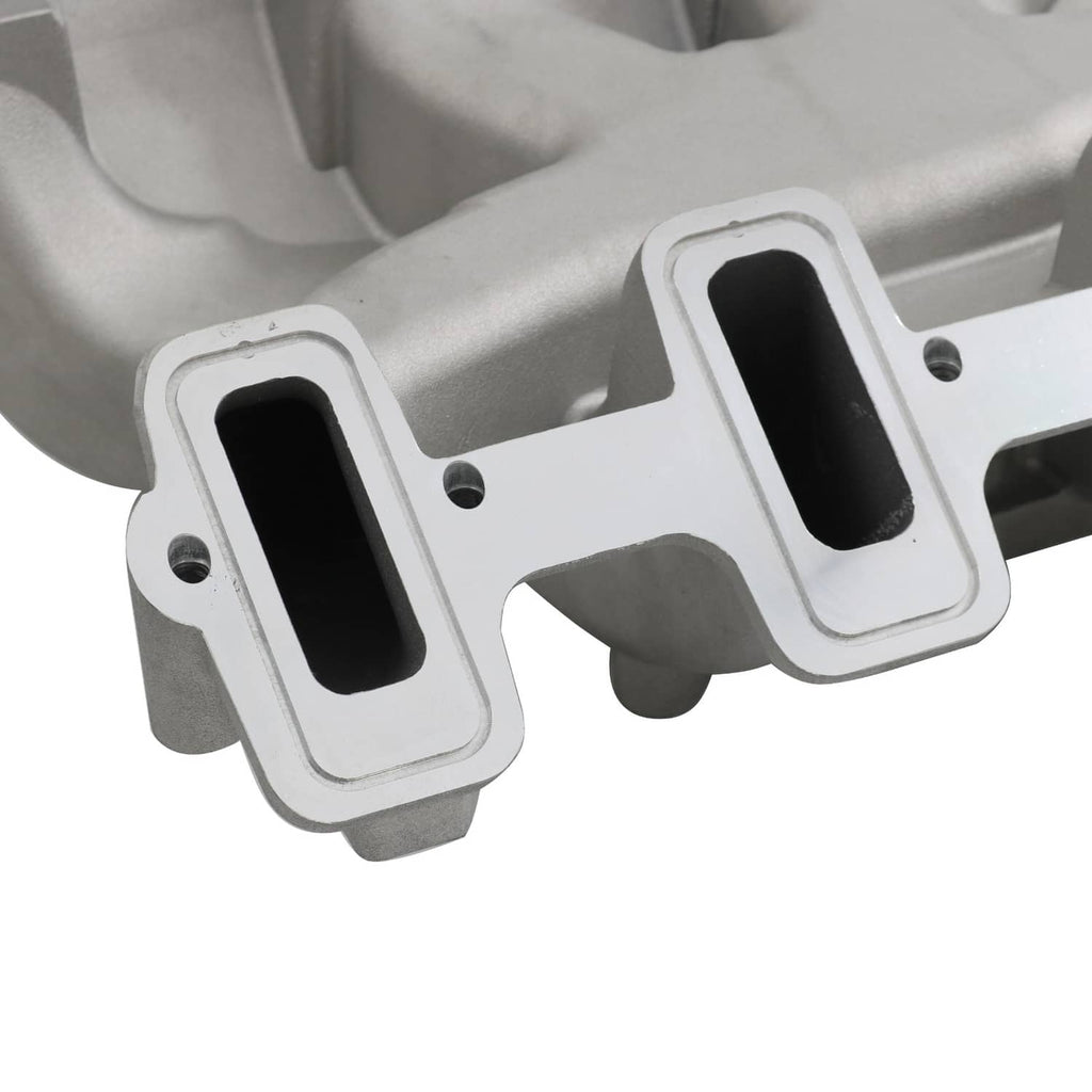 Close-up of gray intake manifold ports with black gasket inserts and mounting holes
