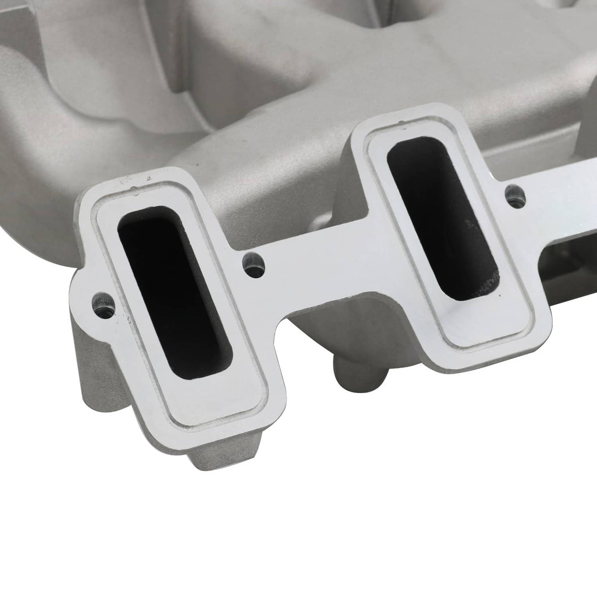 Close-up of gray intake manifold ports with black gasket inserts and mounting holes