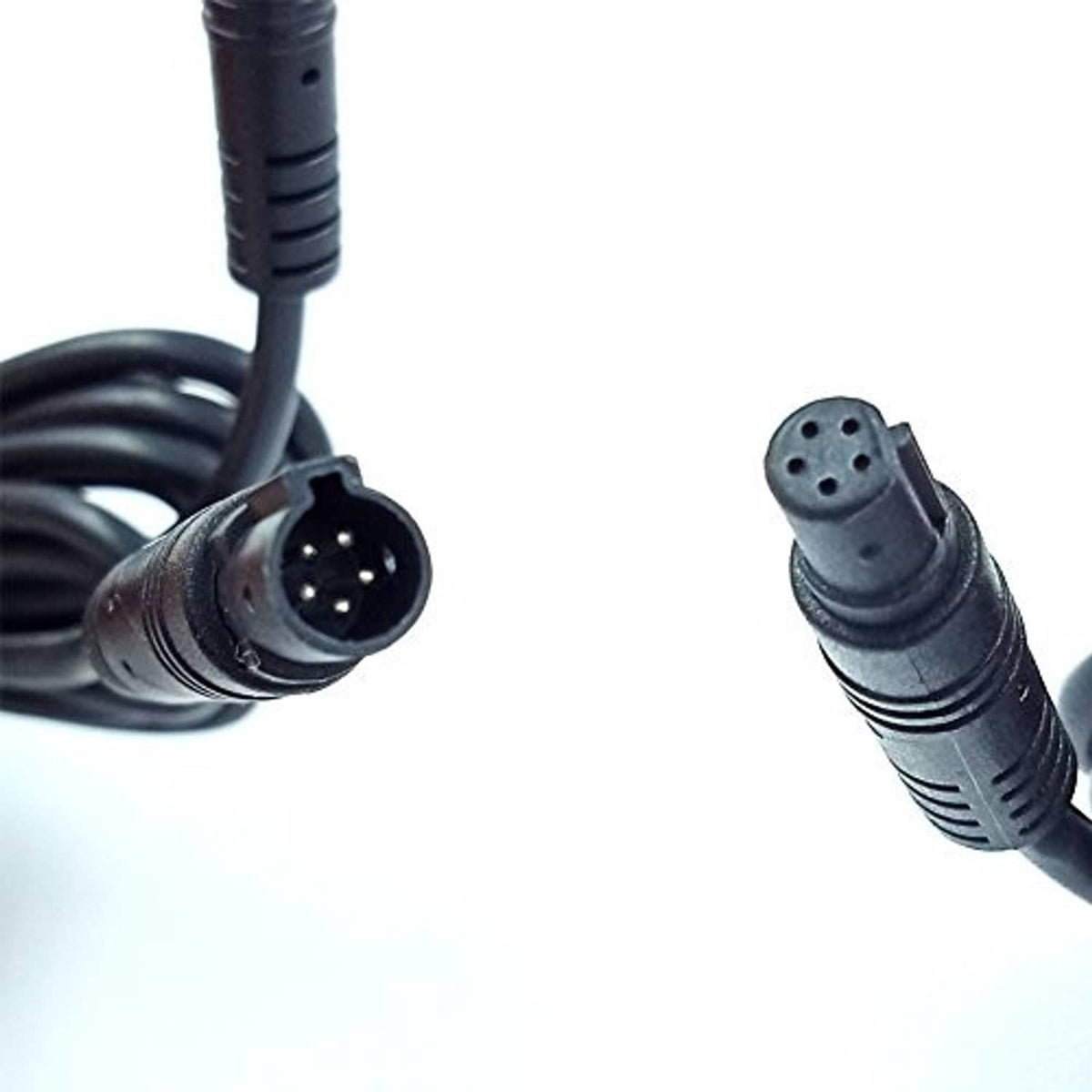 Close-up of black dash cam cable connectors with round 4-pin and 6-pin ends