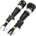 Pair of black front air suspension shock struts with mounting brackets and air spring bags