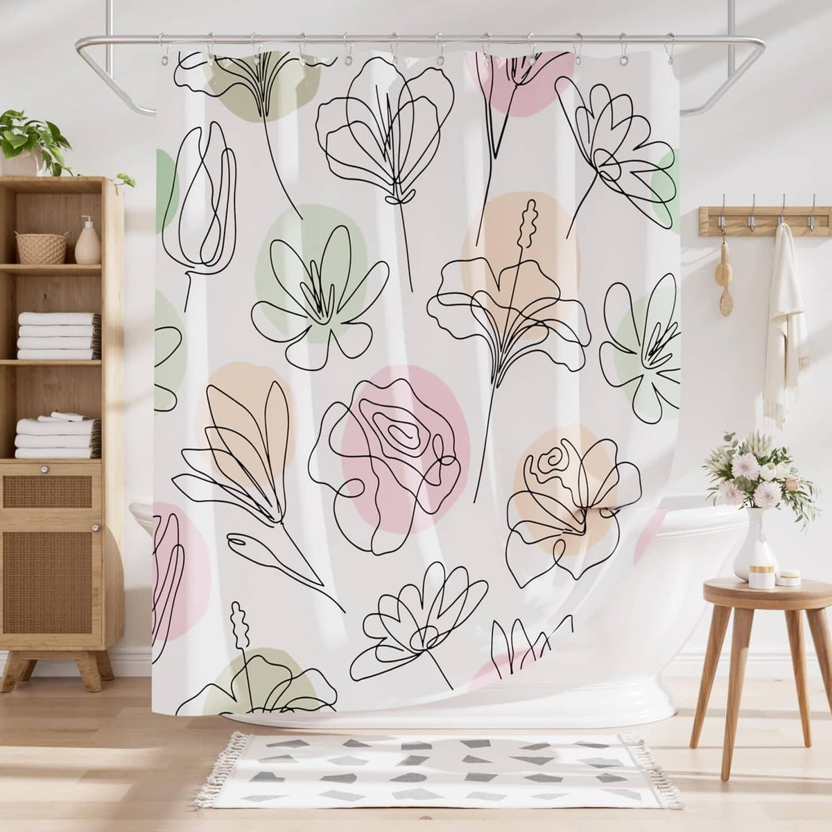 Floral shower curtain hanging from a metal rod, white fabric with pastel bloom outlines