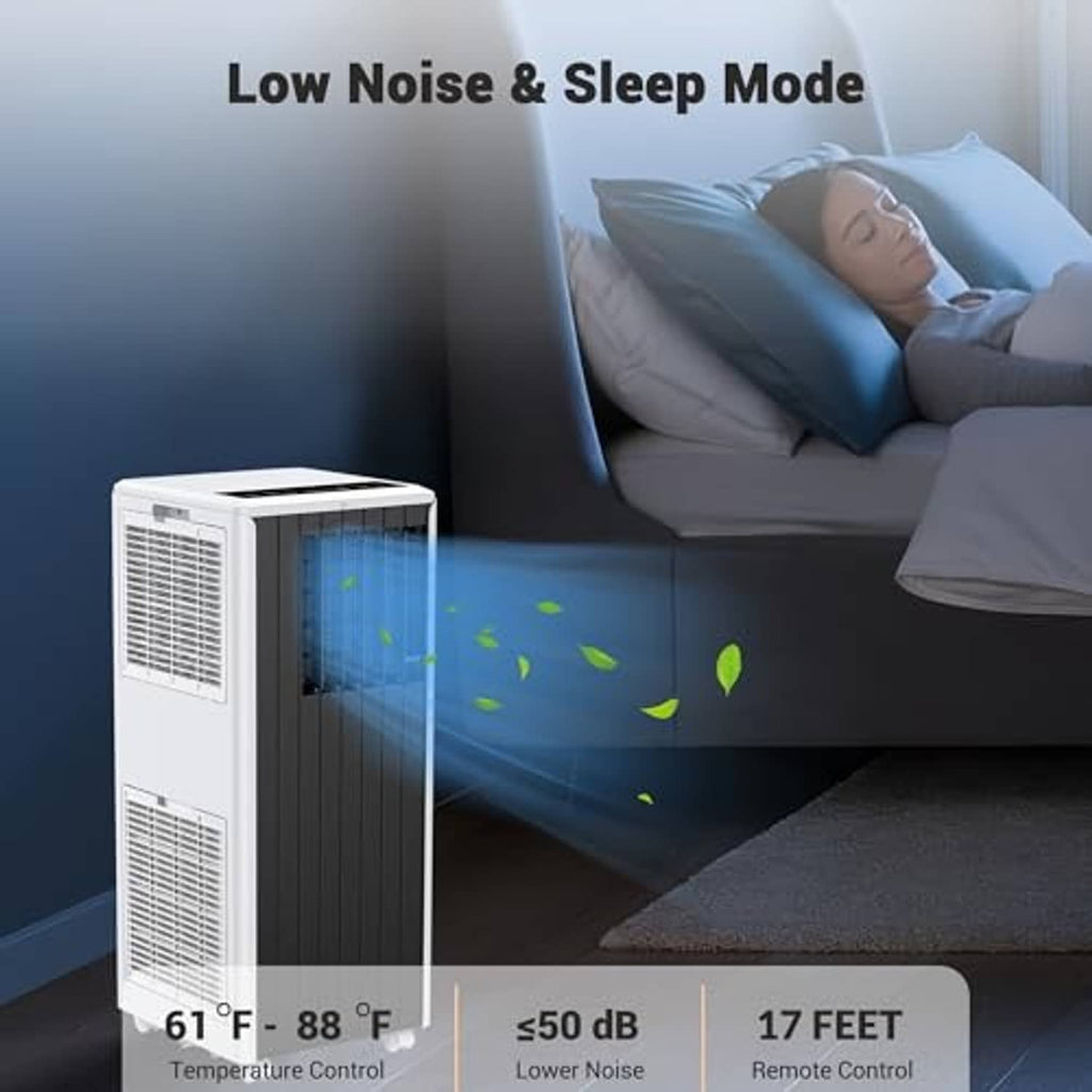 Portable air conditioner with white body and dark front grille, beside a bed.