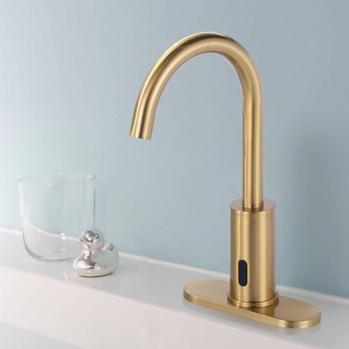 Gold kitchen faucet deck plate base with tall faucet and oval mounting area