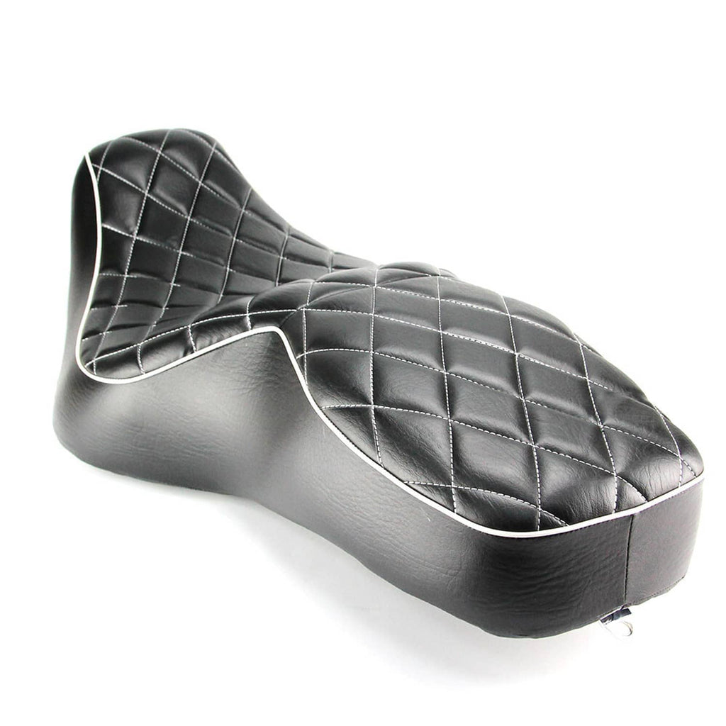 Black motorcycle two-up seat with diamond stitching and white-trim piping along edges