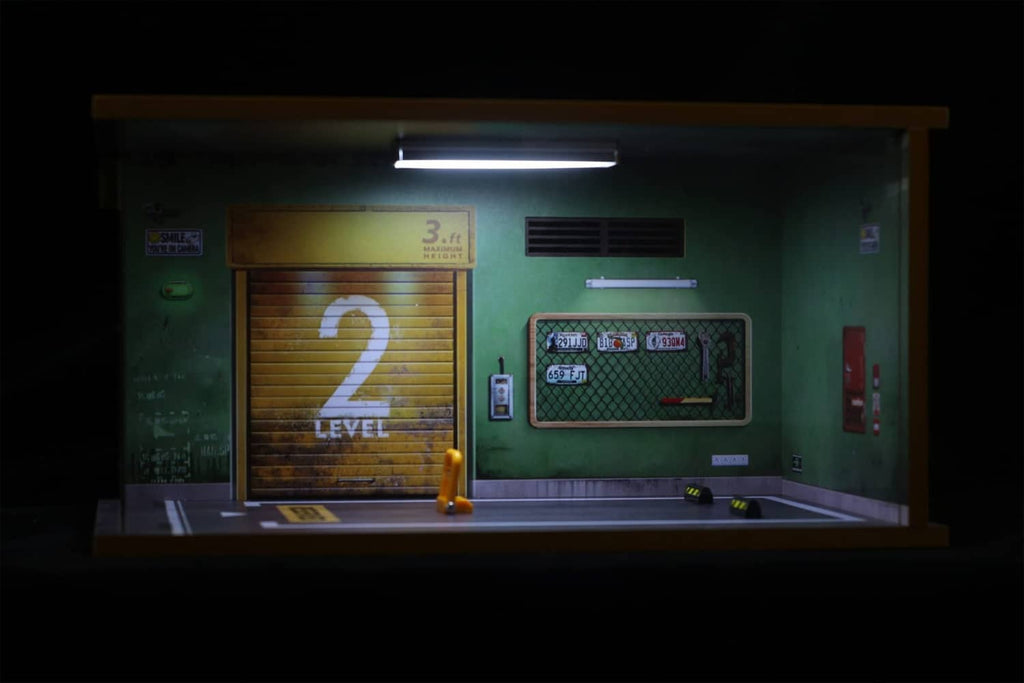 1:18 garage diorama display case with door and wall details behind acrylic