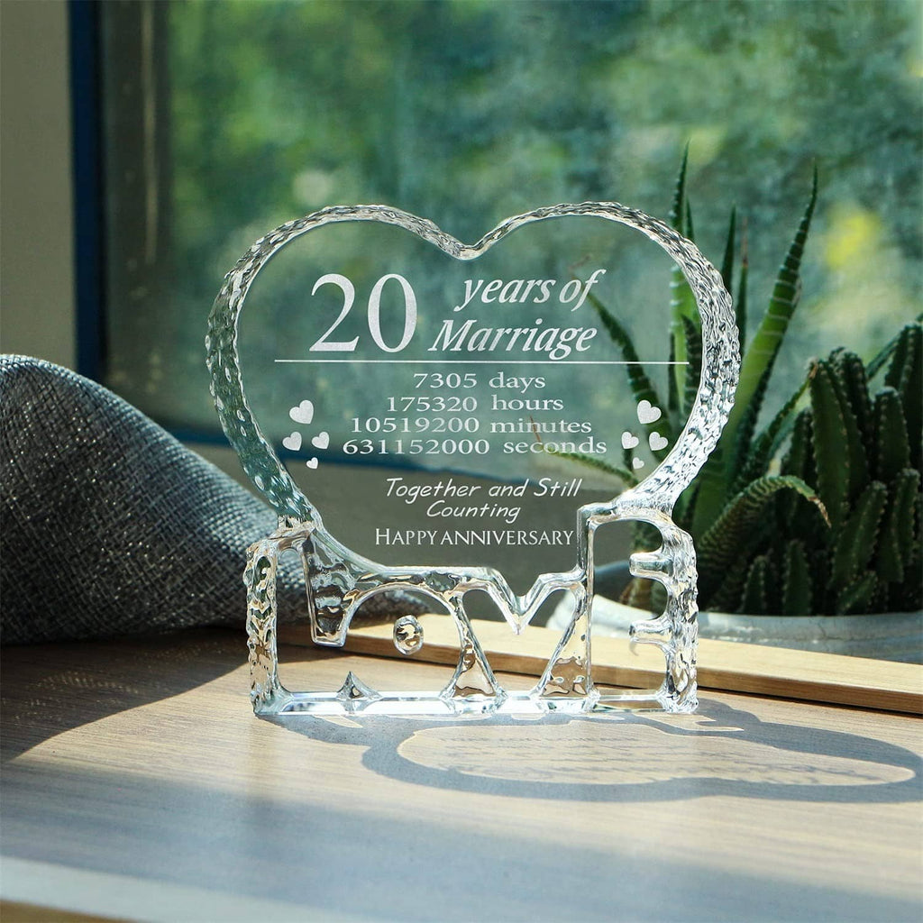 Engraved crystal heart keepsake on tabletop with 20 years of Marriage text in black
