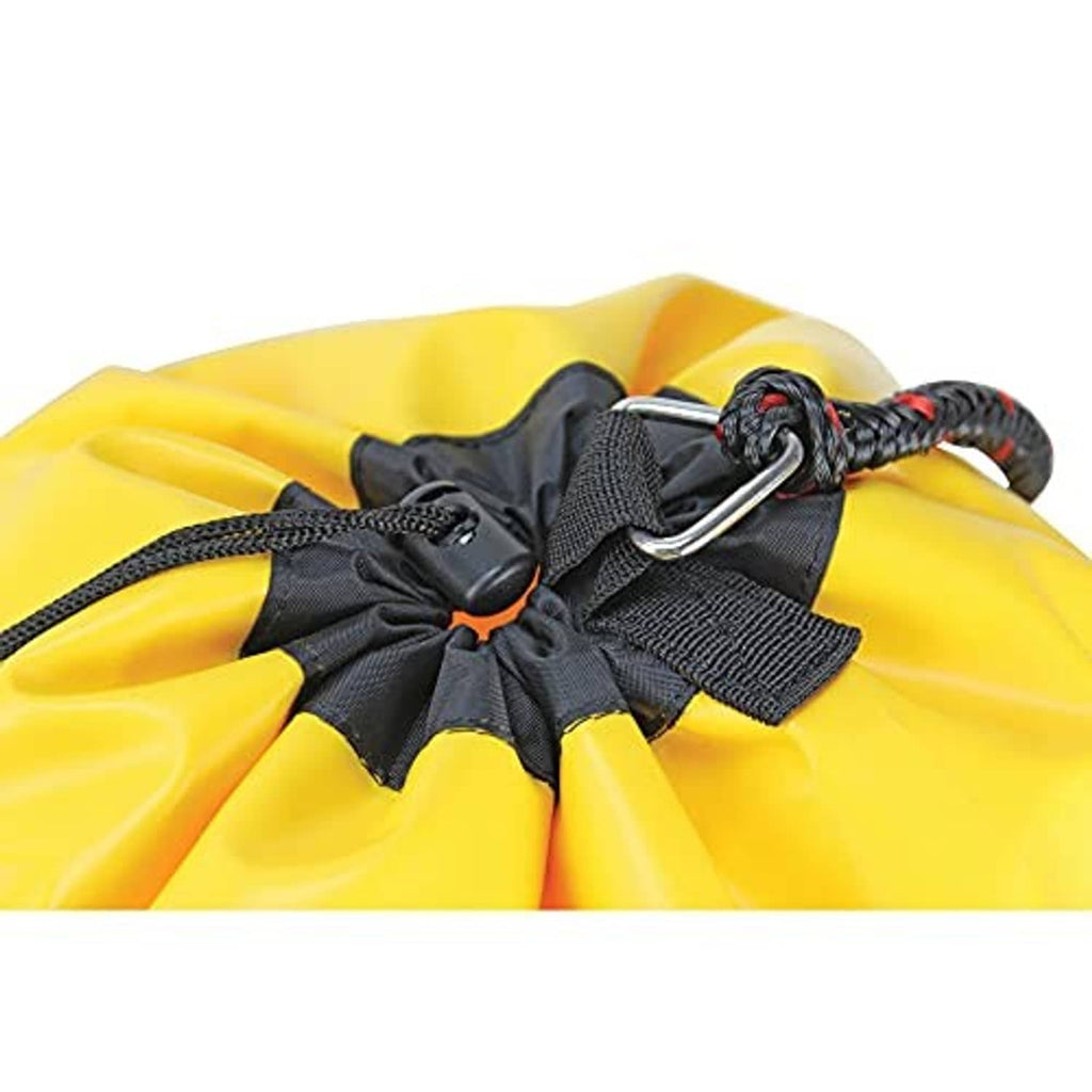 Close-up of black cinch straps and silver metal rings on yellow buoy bag