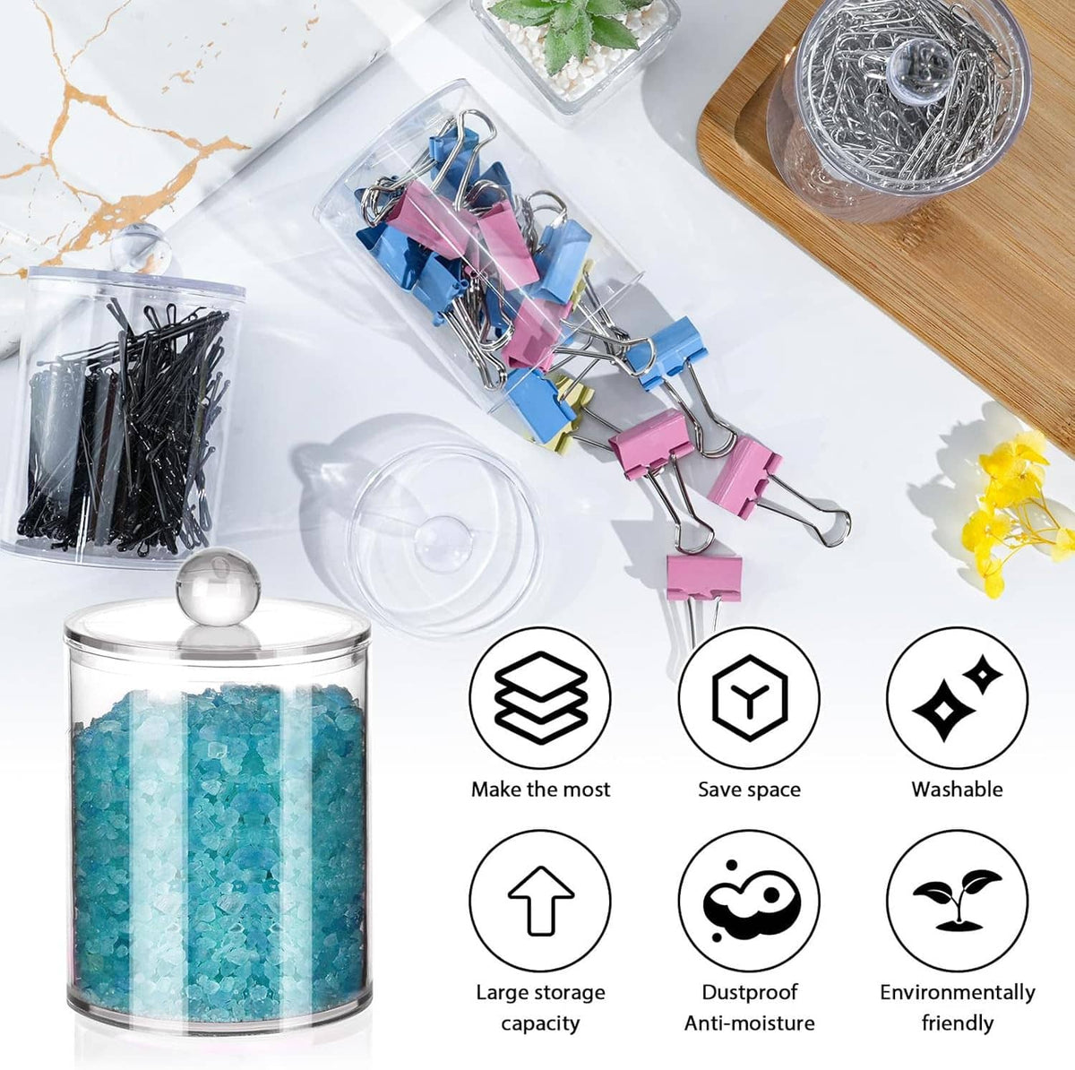 Clear lidded canisters on countertop with colorful binder clips and craft supplies