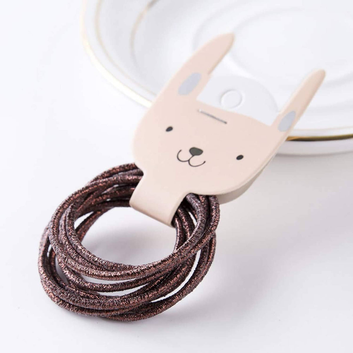 Brown glitter hair elastic loop on bunny-shaped holder