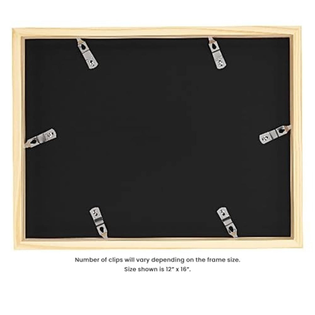 Back view of deep picture frame with black backing, light wood border, and metal clips