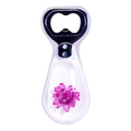 Resin bottle opener with black cap, clear body, purple flower detail