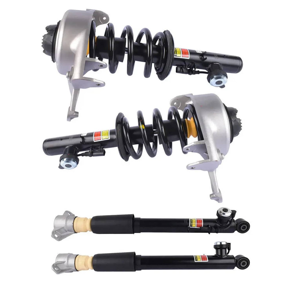 Electronic shock strut assemblies with coil springs, steering arm brackets, and black housings