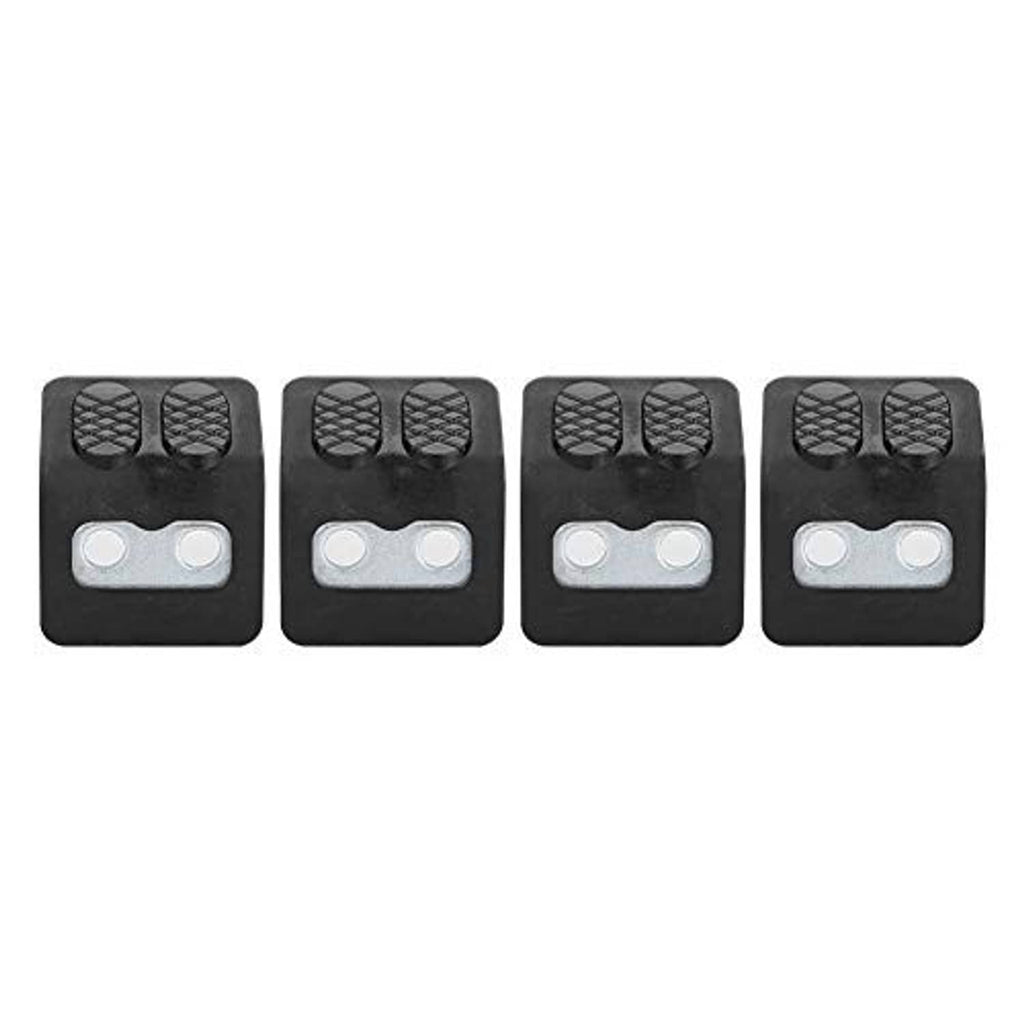 Four black tire rim jaw covers with textured pads and silver double-hole backing