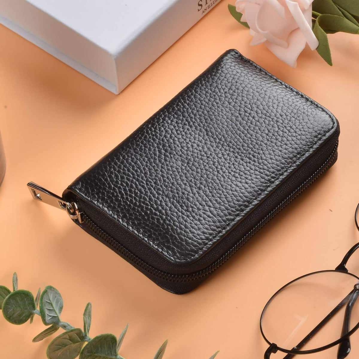Textured black leather credit card wallet with zipper, single front view