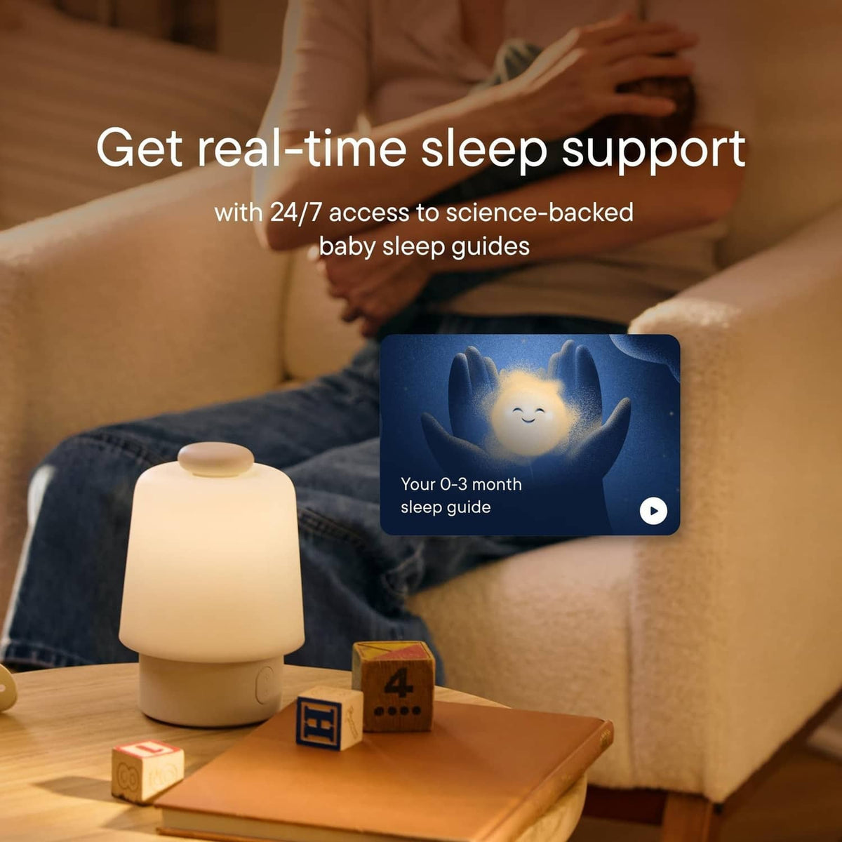 Baby sleep sound machine night light with warm glow and rounded base on table