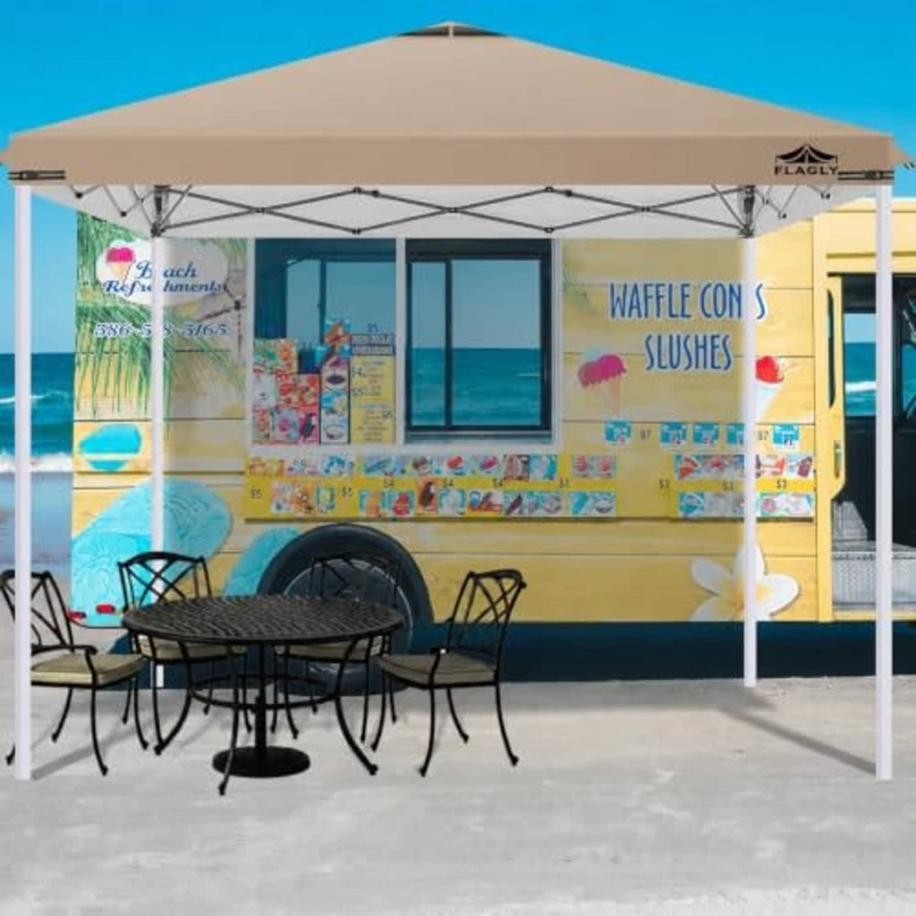 Khaki canopy top mounted over outdoor seating on a metal frame