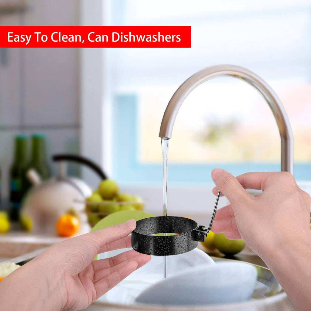 Black nonstick egg cooking ring under running water, hands holding the ring
