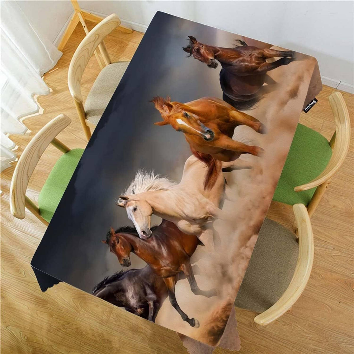 Rectangular horse-print tablecloth draped over table with corner hang and scalloped trim